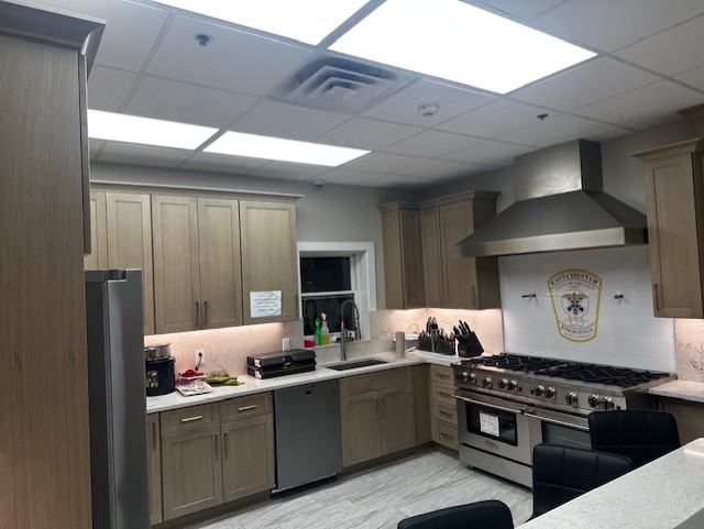 Eastchester EMS custom printed porcelain tile mural installed as a station kitchen backsplash